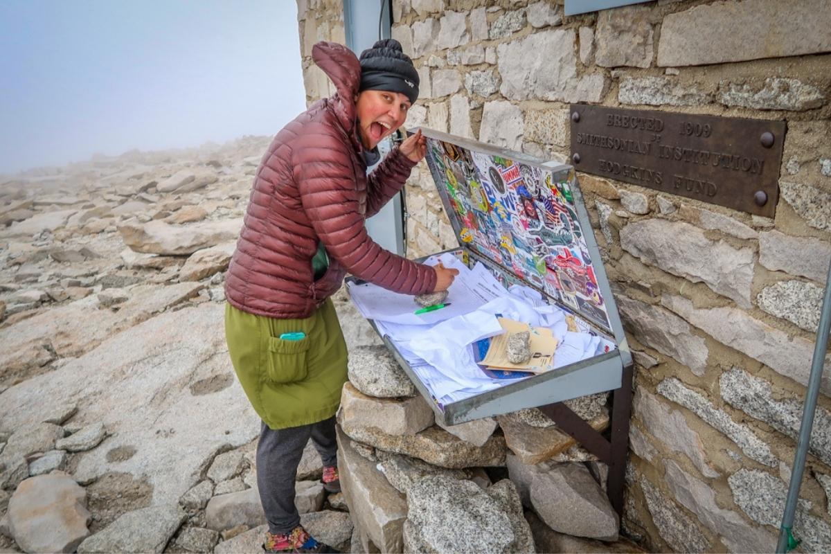 Mount Whitney signing register at summit